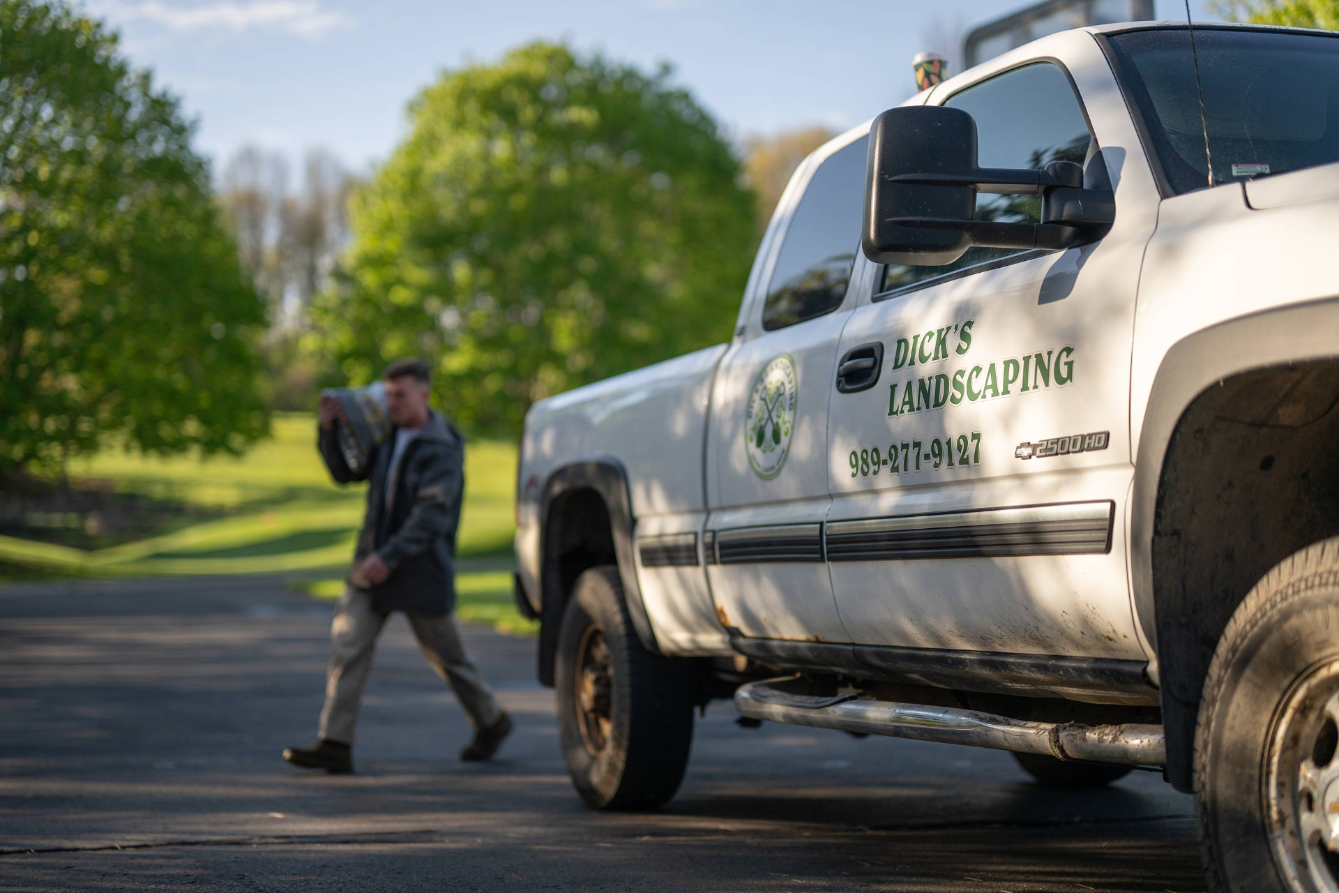 Dick's Landscaping pickup truck on a residential job site in Owosso, MI
